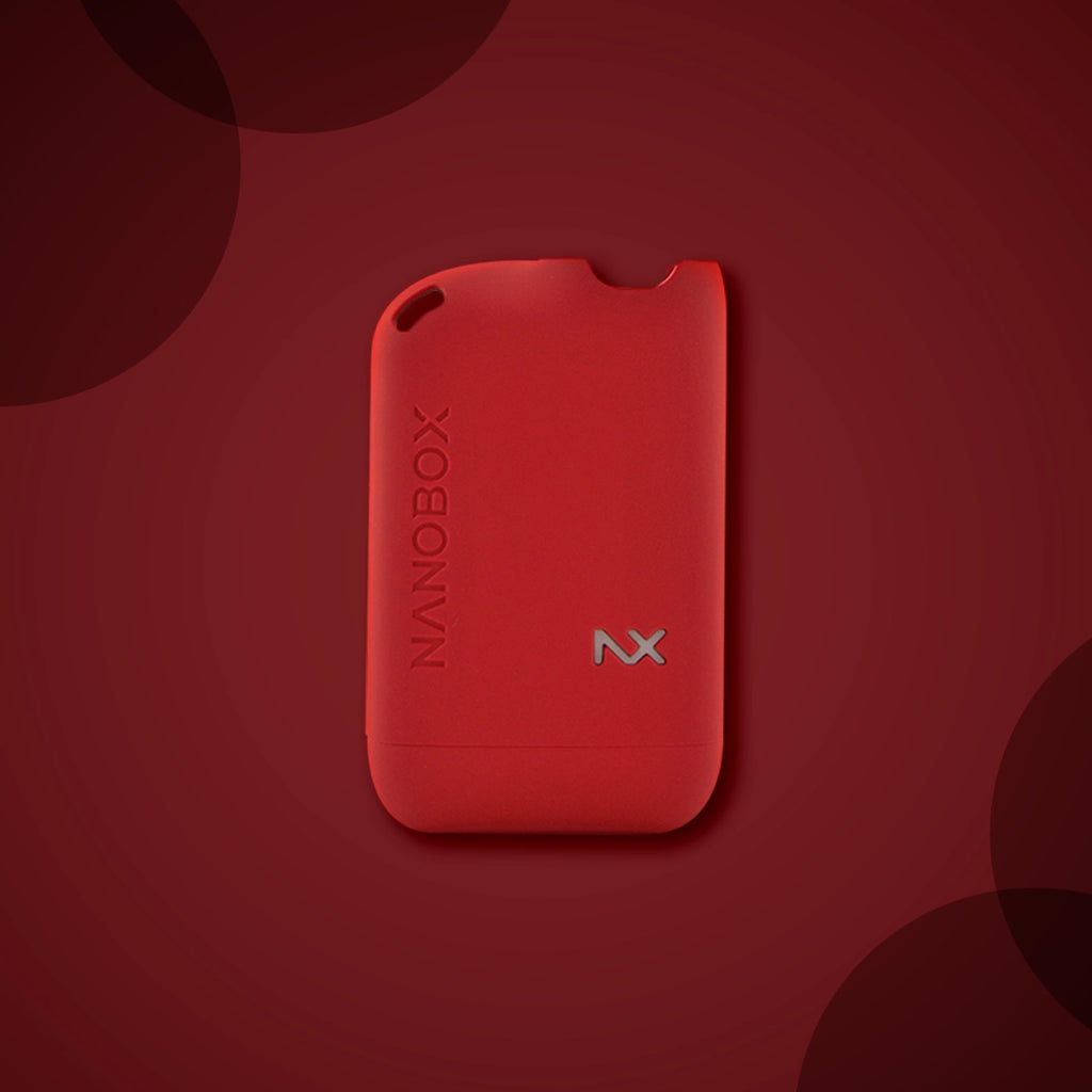 Red NanoBox NX vape device with sleek design on dark red background