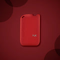 Red NanoBox NX vape device with sleek design on dark red background