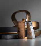 Premium vape devices with textured gold and silver designs, showcasing luxury e-cigarette hardware