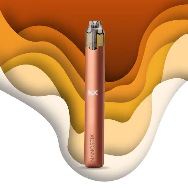 Rose gold Nanostix NX vape pen with layered orange and cream background
