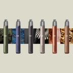 Six colorful Nanostix vape pens in olive, purple, gray, rose, copper, and brown tones