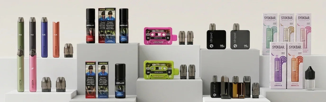 Assorted vape pens, pods, and e-liquid bottles displayed on white shelves for vaping enthusiasts