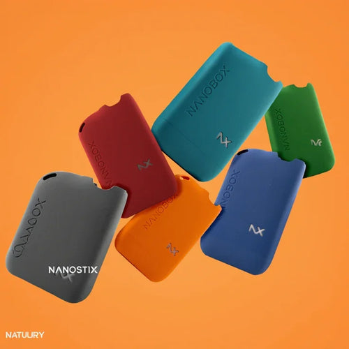 Colorful Nanostix vape pods in red, blue, green, orange, and gray against orange background